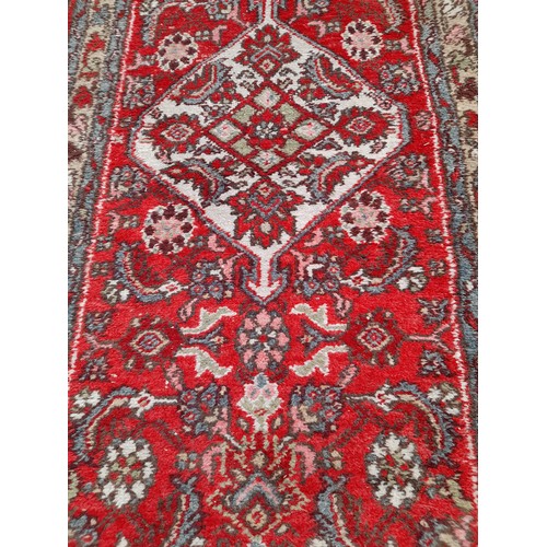 84 - Large Red ground Hand knotted Runner, 307cm x 78cm