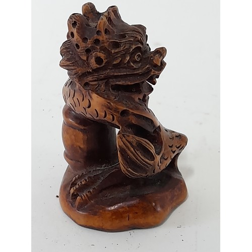 383 - Japanese carved Wood Netsuke with signature to base, 5.5cm high