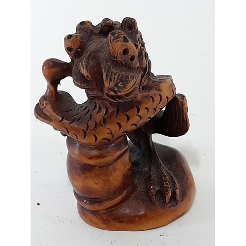 383 - Japanese carved Wood Netsuke with signature to base, 5.5cm high