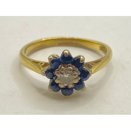 487 - 18ct Gold Diamond and Gemstone Tanzanite/Sapphire? Cluster Ring with Flower Design. Weight 3.11g. UK... 