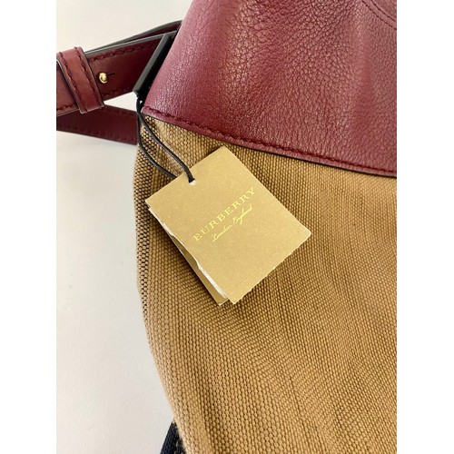 503 - Genuine Burberry London England Ashby Burgundy Red Tassle Handbag. Roughly 40cm x 36cm