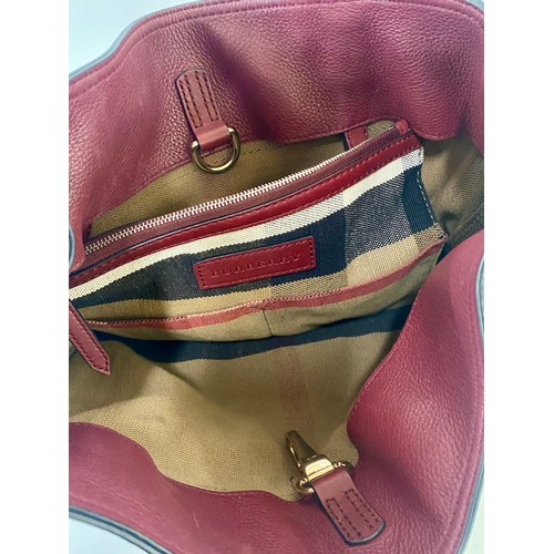 503 - Genuine Burberry London England Ashby Burgundy Red Tassle Handbag. Roughly 40cm x 36cm