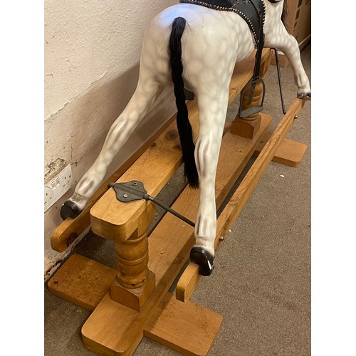 22 - Dapple Grey Rocking Horse Mounted On Wood Base With Saddle And Stirrups. 130 x 51 x 110 cms