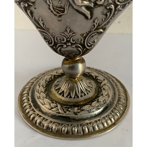 63 - Unmarked Silver Métal 19thC Heart Shaped Tulip Bud Vase With Raised Floral And Cupid Relief
98.2g
9 ... 