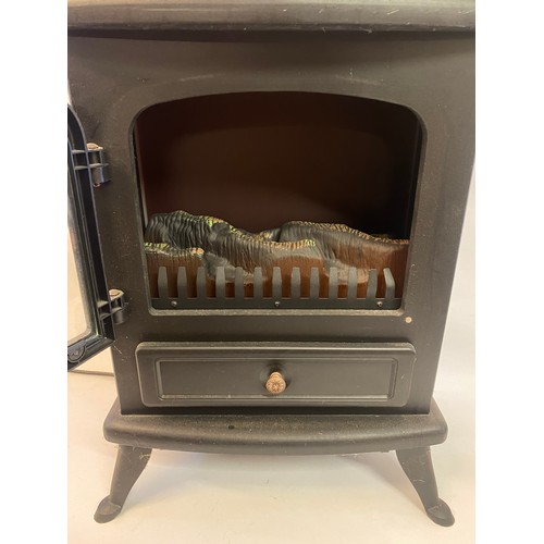 670 - Decorative Log Light Electric Heater Cabinet. 54cm x 43cm x 27cm