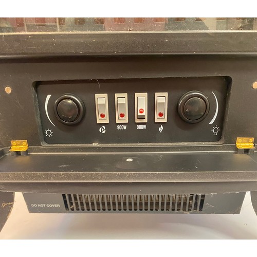 670 - Decorative Log Light Electric Heater Cabinet. 54cm x 43cm x 27cm