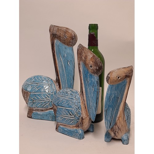 671 - 3 x carved wood Pelicans in Blue, largest 30cm high