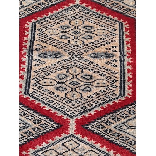 12 - Blue Ground Rug with central Red border pattern, 96cm x 59cm