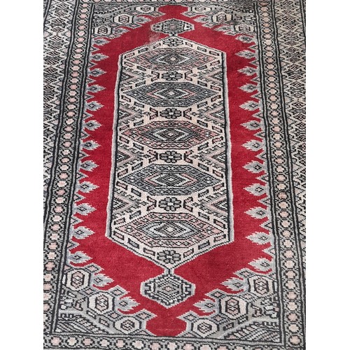 13 - Oriental Blue Ground Rug with central pattern, 96cm x 64cm