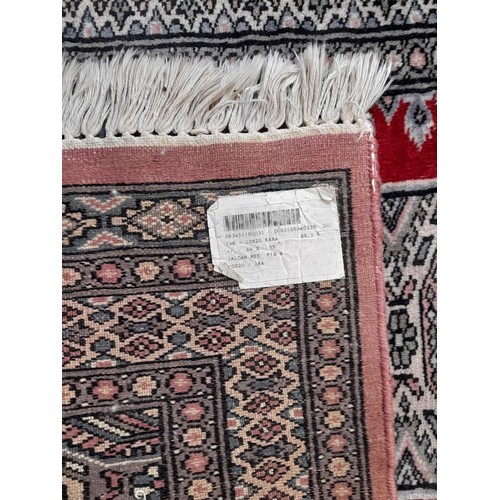 13 - Oriental Blue Ground Rug with central pattern, 96cm x 64cm