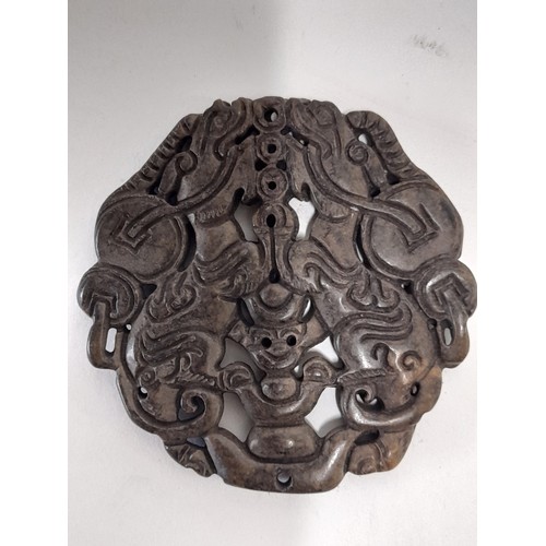 45 - Black Oriental Hardstone Carved Double sided Pendent depicting 2 Dragons, 7cm diameter