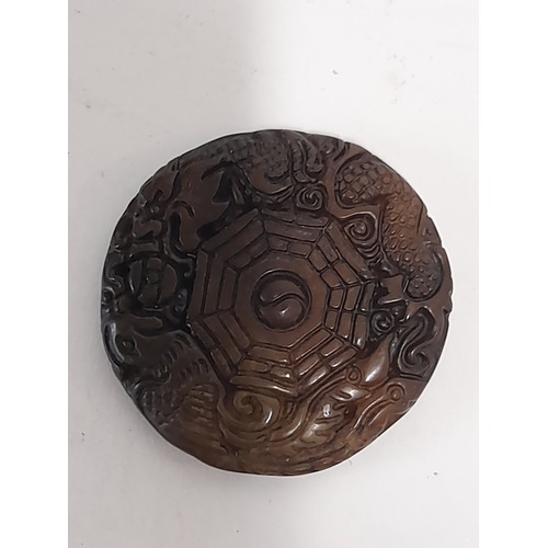 46 - Oriental hardstone carved pendant, 4.5cm dia