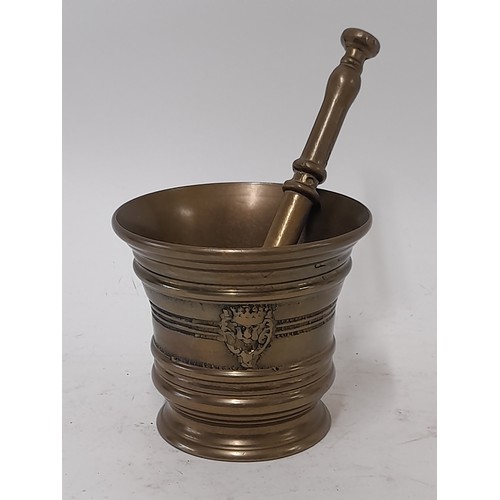 57 - Bronze Pestle 19cm long and Mortar 10cm high,