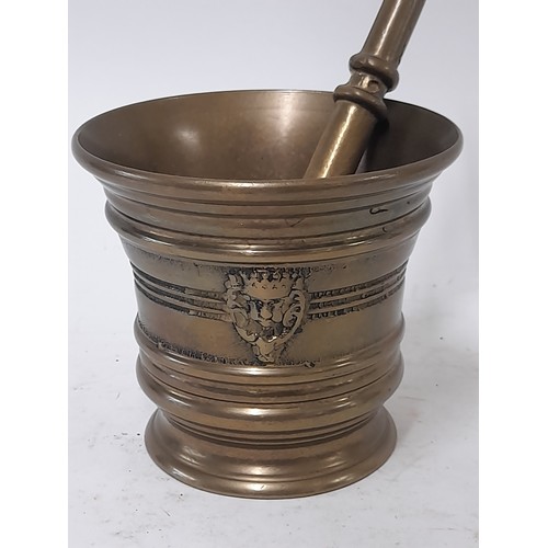 57 - Bronze Pestle 19cm long and Mortar 10cm high,