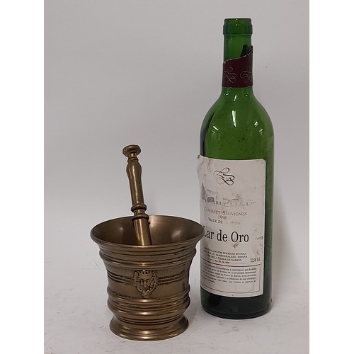 57 - Bronze Pestle 19cm long and Mortar 10cm high,