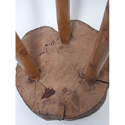 82 - Folk Art style 3 Legged Stool with Whittled Legs And a Cross section cut trunk Seat, 45cm high x 32c... 