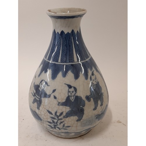 89 - Blue and White Chinese Vase with crackle glaze finish depicting children in various activities, 20.5... 