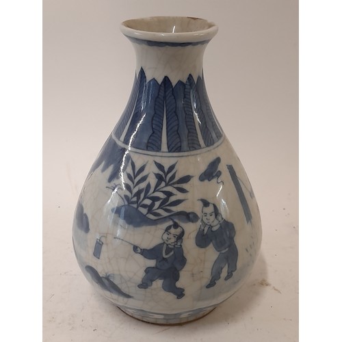 89 - Blue and White Chinese Vase with crackle glaze finish depicting children in various activities, 20.5... 