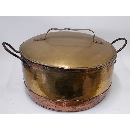 98 - Large brass and copper cooking vessel with lid and 2 iron side handles, 35cm high x 49cm high