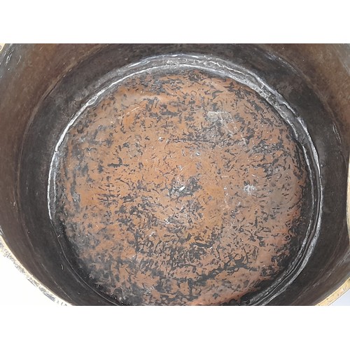 98 - Large brass and copper cooking vessel with lid and 2 iron side handles, 35cm high x 49cm high