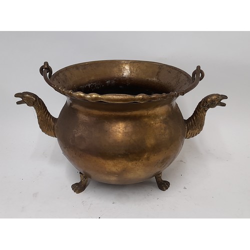 99 - Brass French Pot with swing handle standing on 3 Paw Feet and having Bird adornments to the side, 29... 