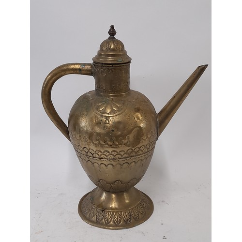 103 - Brass water Jug with lid and Repousse decoration, 38cm high x 31cm wide