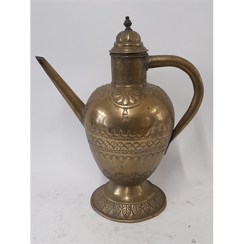 103 - Brass water Jug with lid and Repousse decoration, 38cm high x 31cm wide