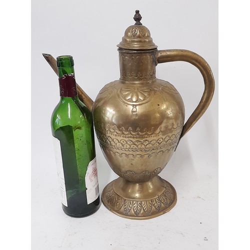 103 - Brass water Jug with lid and Repousse decoration, 38cm high x 31cm wide