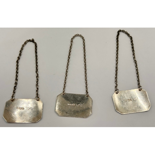 128 - Three Silver Hallmarked Bottle Tags. 19grams.  (3)