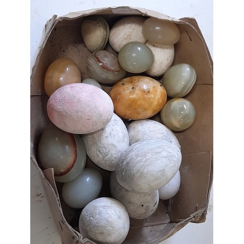 114 - Quantity of Carved stone Eggs, largest 6cm long