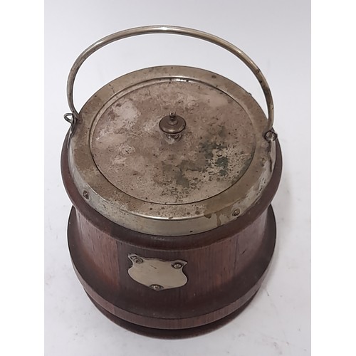 115 - Oak Biscuit Barrel with lid and swing handle, blank Cartouche shield to front, 15cm high