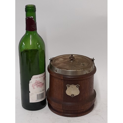 115 - Oak Biscuit Barrel with lid and swing handle, blank Cartouche shield to front, 15cm high