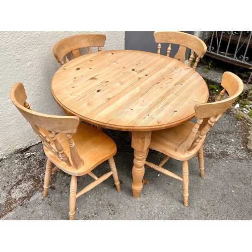 59 - Circular Table and Four Chairs. 107cm x 77cm.