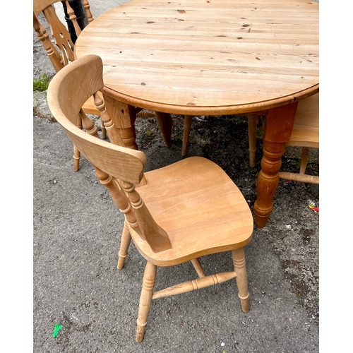 59 - Circular Table and Four Chairs. 107cm x 77cm.