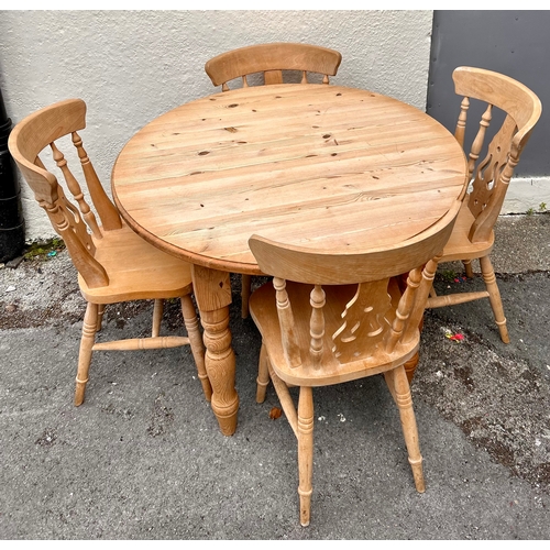 59 - Circular Table and Four Chairs. 107cm x 77cm.