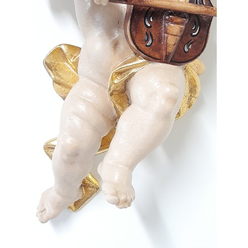 38 - Composite Winged Cherub Figure, 24cm high