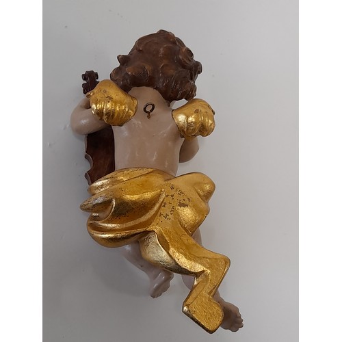 38 - Composite Winged Cherub Figure, 24cm high