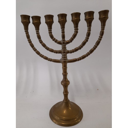 120 - Two Brass Menorah's, largest 25cm wide x 19cm high (2)