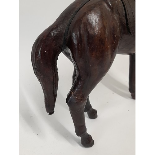 134 - Leather Clad Horse, 34cm long x 32cm high