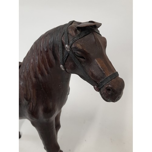 134 - Leather Clad Horse, 34cm long x 32cm high