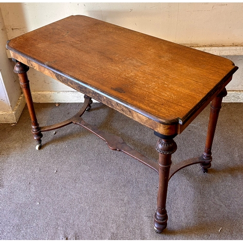 69 - Antique Occasional Table On Casters. 103cm x 53cm x 73cm.