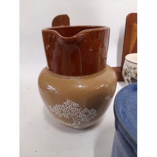 108 - A collection of of items to include Stoneware Cabury Jug with crack, 4 x Biltons Animal Mugs, a Chur... 