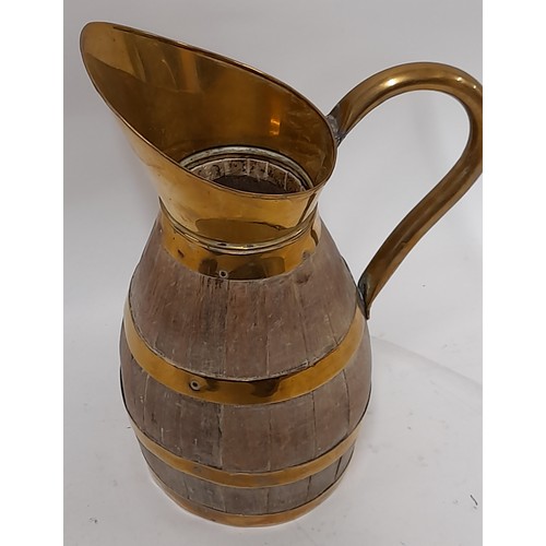 34 - Brass and wood coopered Barrel Jug, 24cm high