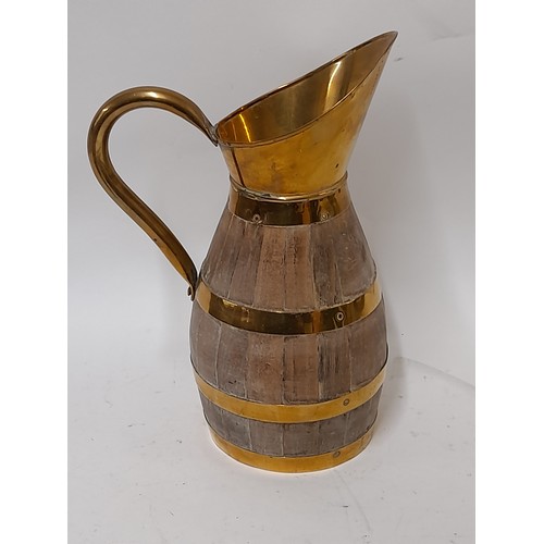 34 - Brass and wood coopered Barrel Jug, 24cm high