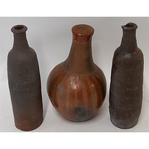 42 - 3 x Continental wood fired clay bottles, tallest 28cm high