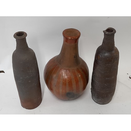 42 - 3 x Continental wood fired clay bottles, tallest 28cm high