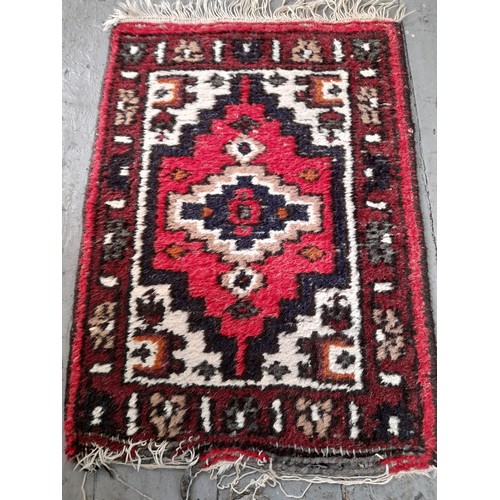 24 - Decorative Red Ground Rug,  70cm x 52cm