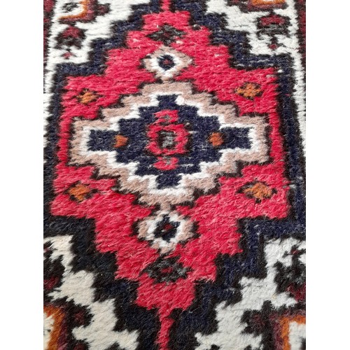 24 - Decorative Red Ground Rug,  70cm x 52cm