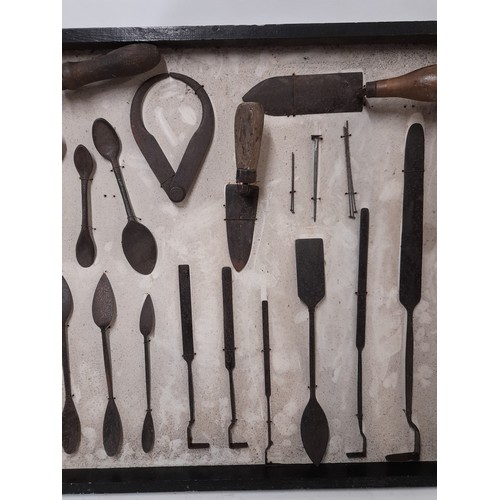 25 - Display Board of Vintage tools possibly for use in cast Iron Mouldings, 61cm x 51cm