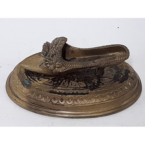 63 - Brass Shoe on a Plinth, 11.5cm long x 6cm high